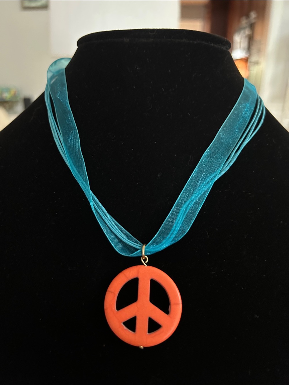Turquoise Ribbon Necklace with Orange Peace Sign Pendant